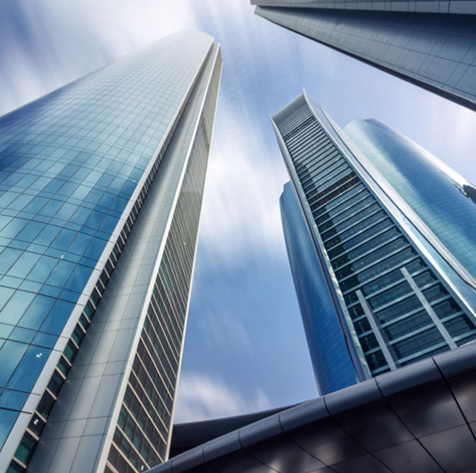 Skyward view of tall business towers.